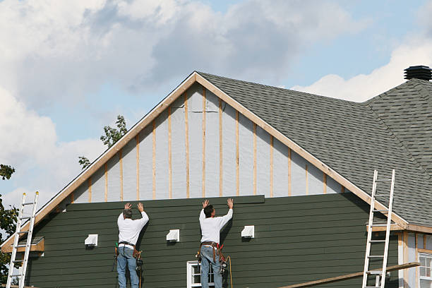 Professional Storm Damage Siding Repair technician working in Huntsburg, OH